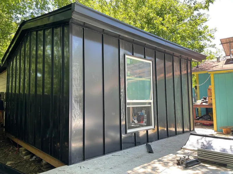 Black standing seam metal wall panels for Roof Inspection in Los Fresnos