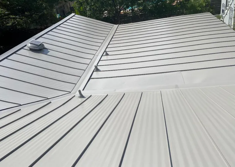 Solar attic fan installed on a metal roof for Roof Ventilation in Los Fresnos